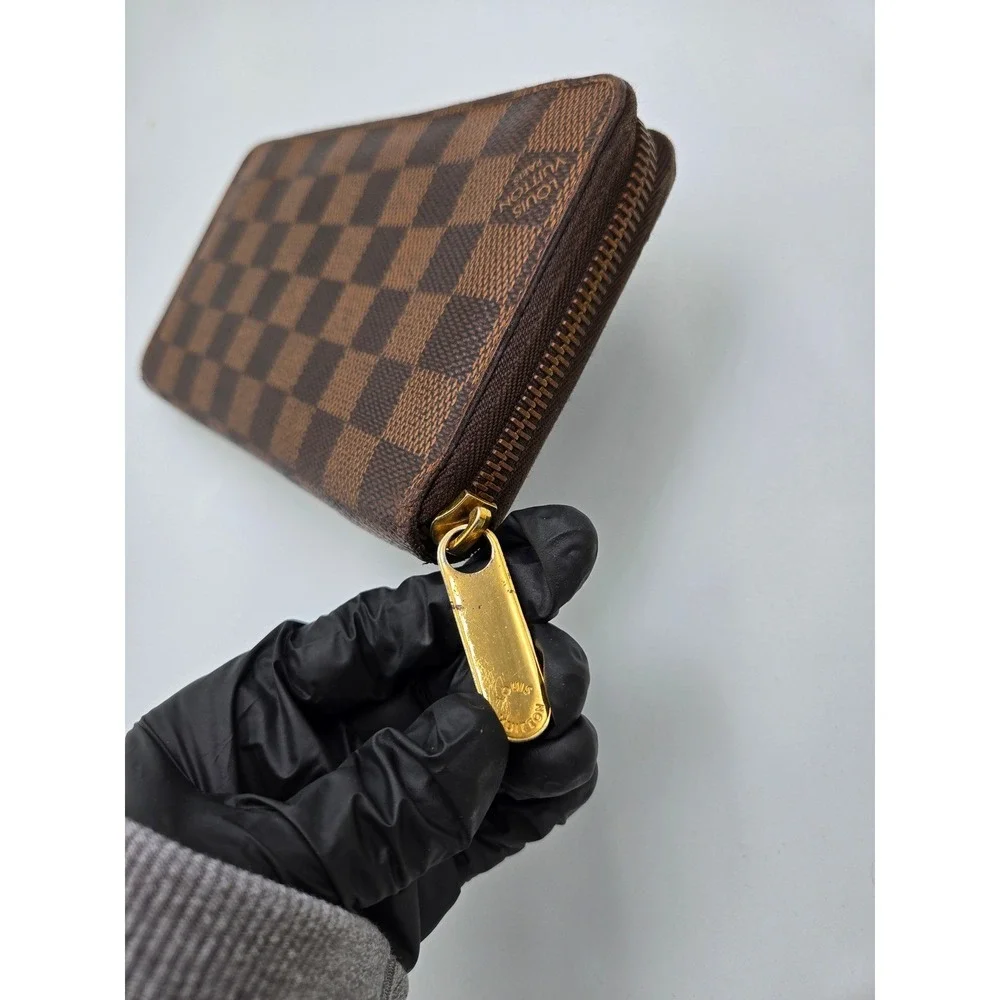 Louis Vuitton Damier Ebene Zippy Wallet Brown Coated Canvas